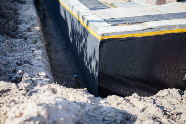 Professional Waterproofing technician working in Norwood, NY